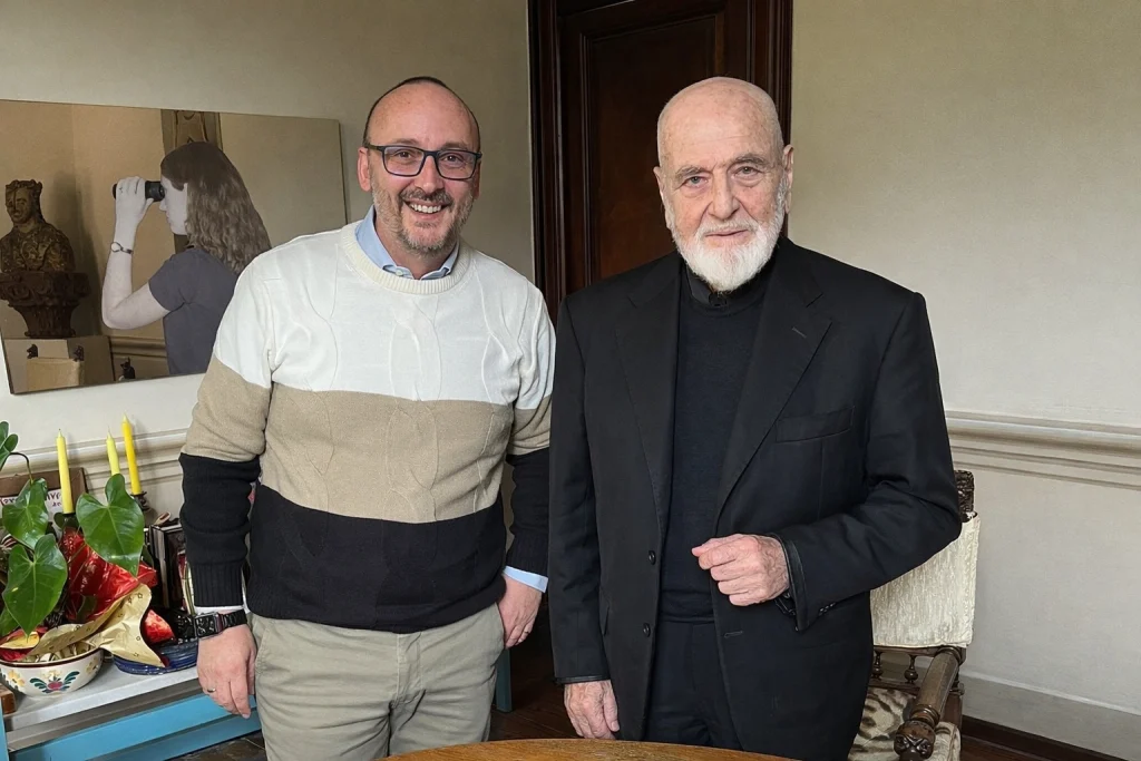 Michelangelo Pistoletto with Antonino La Vela, with a mirror painting in the background.